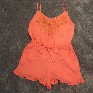 Peach romper. Brand new- but no tags. Size L